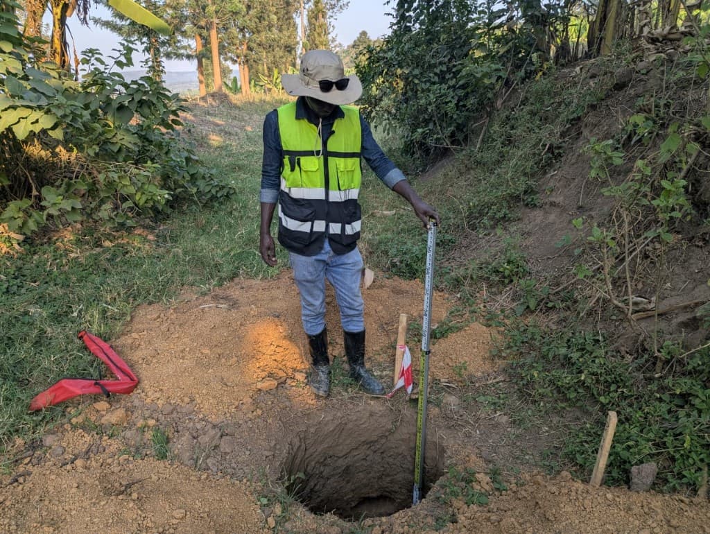 Geotechnical field investigation — measuring excavation depth on site